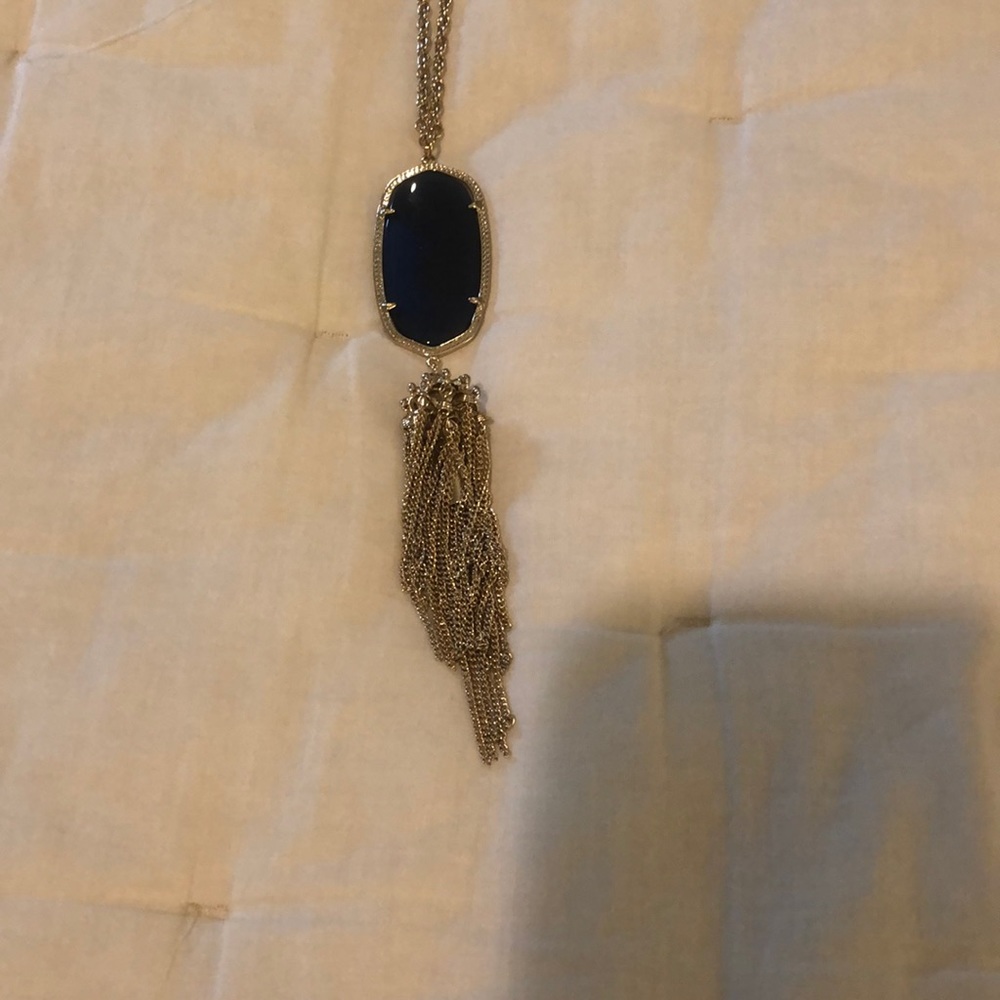 Kendra Scott necklace with navy blue stone and gold fringe